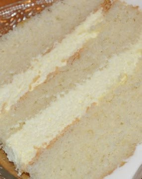 a slice of white cake sitting on top of a plate