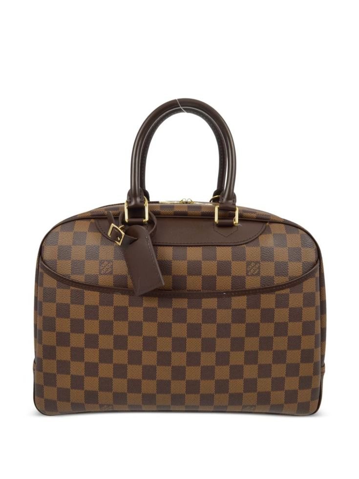 circa 2008 brown signature Damier Ebène canvas leather trim debossed logo to the front two rolled top handles two-way zip fastening main compartment internal slip pocket internal patch pockets canvas lining slip pocket to the front luggage tag logo-engraved gold-tone hardware Condition: GOOD. This previously owned and used item is in good condition with minimal signs of use. This may include fading of material or plating and scratches. Purchasing this item continues its narrative and reduces the environmental impact by avoiding the use of new resources needed to make the product from scratch, such as water, materials and electricity, and avoiding additional manufacturing impact. Learn more about what makes a product Conscious on our Conscious Criteria page