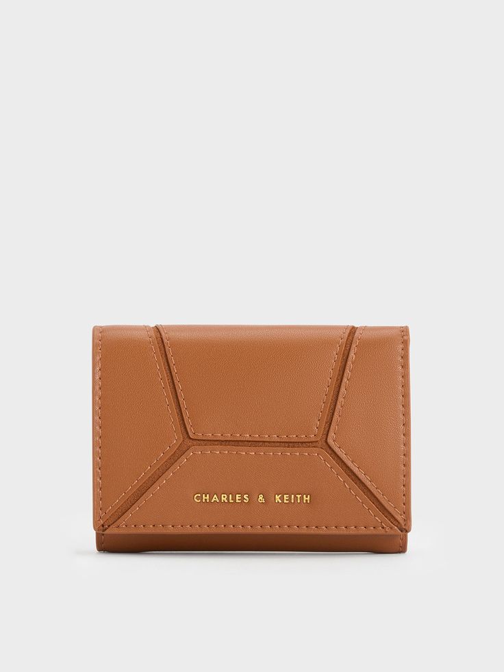 This product is made with at least 20% sustainable materials by weight. CHARLES & KEITH uses recycled, degradable, organic, and water-based materials in our eco-conscious collection.In a gorgeous shade of chocolate-brown, this Nasrin wallet will certainly please those with a penchant for neutral hues. The basic rectangular silhouette has been elevated by geometric panels stitched together to create a sleek yet eye-catching design. This wallet opens up to a well-compartmentalised interior, which Versatile Brown Wallets With Interior Card Slots, Modern Brown Rectangular Card Holder, Versatile Brown Wallet With Rfid Blocking, Versatile Brown Wallet For Gift, Versatile Brown Wallets For Gift, Versatile Brown Wallets For Gifts, Modern Brown Wallet For Gift, Modern Brown Wallets For Gift, Modern Brown Wallets For Gifts