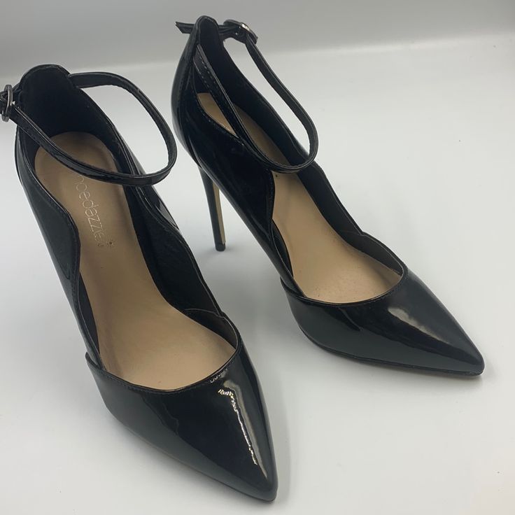 Beautiful Black Faux Patent Leather Stiletto Pumps. Uppers Are Sculpted High At The Ankle Then Down Low At The Toe. Included Is A Delicate, Adjustable Ankle Strap. The Toe Sweeps Back At A Gentle Angle To The Sole. 4.5” Stiletto Heel. The Shoes Are Brand New, With No Visible Wear. P-85 Closed Toe Court Shoes With Buckle For Party, Black High Heel Court Shoes With Buckle Closure, Black Ankle Strap Court Shoes With Buckle Closure, Trendy Black Court Shoes For Party, Trendy Black Party Court Shoes, Black Court Shoes With 4-inch Heel And Ankle Strap, Chic Synthetic Ankle Strap Court Shoes, Elegant Black Court Shoes With Buckle Closure, Elegant Ankle-high Black Court Shoes