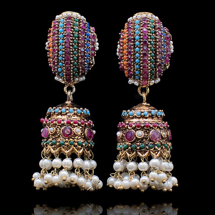 pair of multicolored beaded earrings on black background