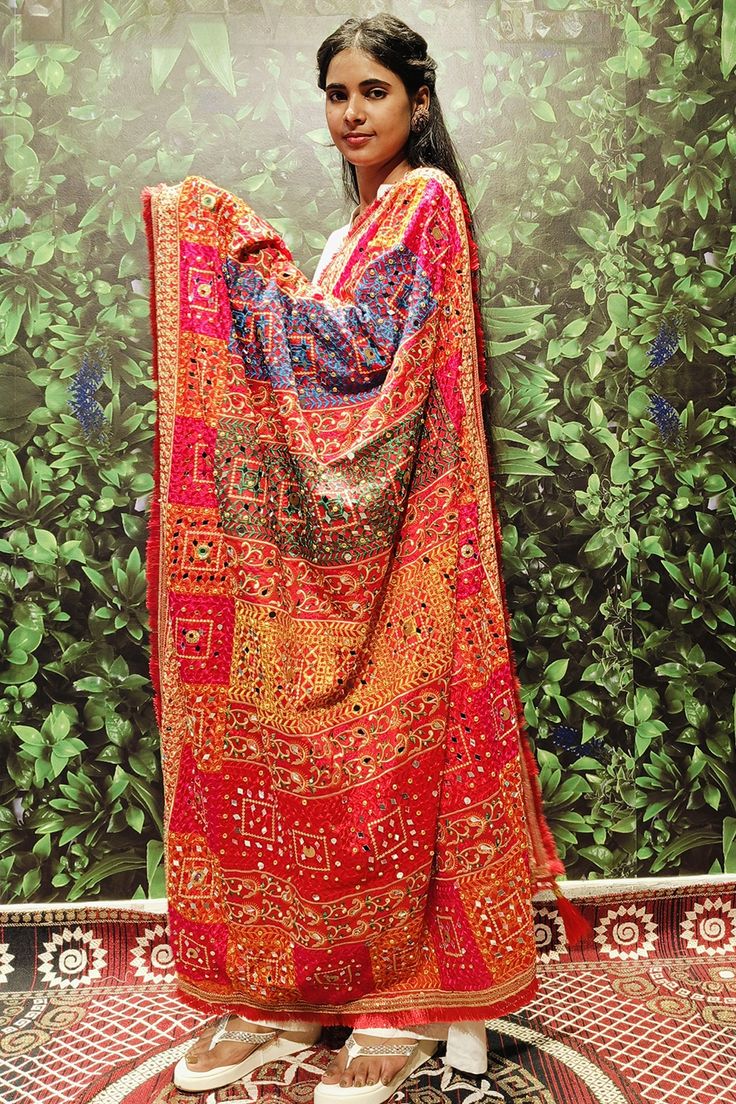 Description This elegant red dupatta features multi-color mirror, beats, and stone work with a heavy border, making it a perfect accessory for women. The beautiful design and high-quality materials are sure to add a touch of sophistication to any outfit. Elevate your style with this stunning dupatta. About Fabric Silk Length 2.5 Meter Pattern Printed Care instructions Dry Clean Only Embroidery type Mirror, Beads Stone Work Color Red Multi Color Red Chanderi Saree With Bandhani Print, Red Dola Silk Sharara With Mirror Work, Red Kundan Sharara With Dupatta, Red Semi-stitched Saree For Festivals, Red Chanderi Dupatta With Traditional Drape, Semi-stitched Red Choli With Bandhani Print, Red Unstitched Traditional Wear With Bandhani Print, Red Unstitched Traditional Wear With Dupatta, Red Bandhani Print Unstitched Dupatta