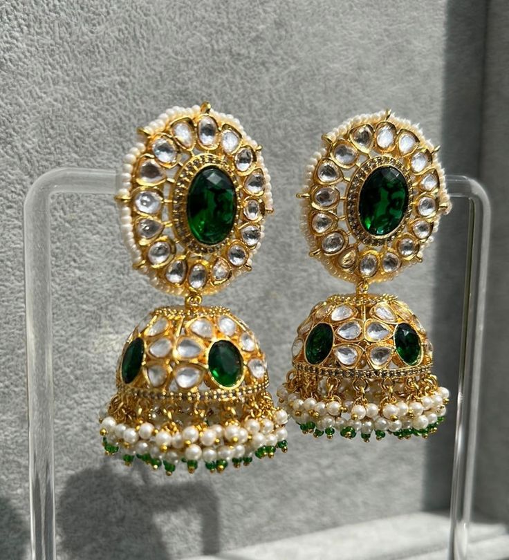 Handmade Style: Traditional Kundan Jhumka Earrings Material: 18k Yellow Gold Plated, Lab Simulated Emerald Stones, Kundan Stones, Pearls Imported Item Number: 7073E 22k Gold Green Chandbali Earrings, Green 22k Gold Chandbali Earrings, Bollywood Style Kundan Jhumkas In Yellow Gold, Green 22k Gold Earrings With Intricate Design, Yellow Gold Kundan Jhumkas, Yellow Gold Kundan Jhumkas With Cutdana, Yellow Gold Round Kundan Jhumkas, 22k Gold Hand Set Jhumkas As Gift, Traditional Hand Set Drop Jhumkas