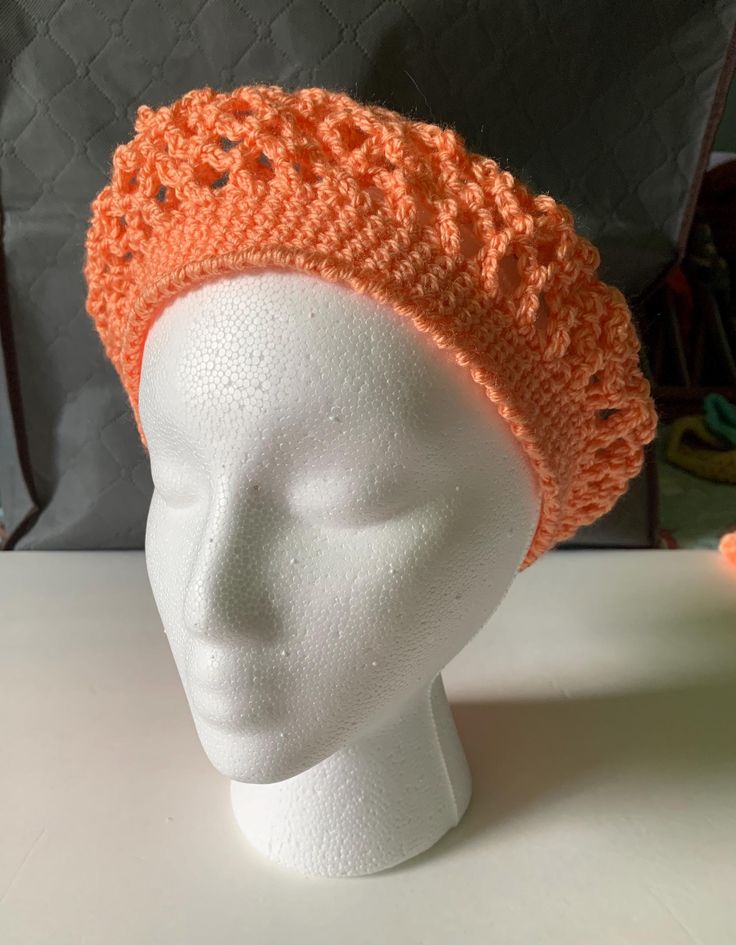 I hand crochet this lacey beret to be lightweight. Not just for winter, an open weave transitions the seasons. Wear as a fashion statement with a boho vibe. The Apricot orange color acrylic yarn is machine washable. 20" band fits most adults. Fitted Crochet Hat For Spring, Hand Knitted Spring Hats, Fitted Crochet Yarn Hat, Spring Crochet Beanie Hat, Spring Crochet Lace Hat, Fitted Crochet Cap For Spring, Fitted Crochet Spring Cap, Handmade Slouchy Hats For Spring, Spring Crochet Slouchy Hat