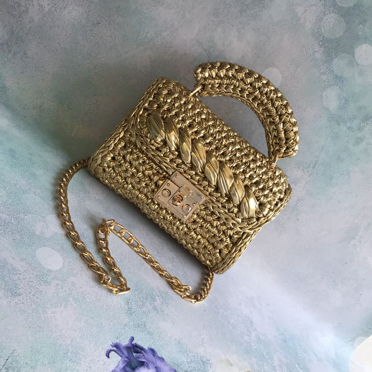 Crochet luxury gold metallic ladies shoulder bag👜.  💥The crochet luxury bag is made with premium leather metallic yarn.  💥leather metallic yarn  💥stainless accessory  💥satin lining (matching the color of the bag)  💥100 cm hanger length (I can make it longer according to preference)  💥clean workmanship  💥custom design 😍  📐Measurements of knitted bags:           20x9x17  💫Handmade personalized bag is suitable for shoulder and crossbody use. (It can also be used as a handbag if you prefer.)  ❤️I can make it in any size.  💥Free EXPREES shipping internationally 🌏✈️  💥Handmade knitted gold bag will add elegance to your elegance in your daily use and special days, invitations and parties.😍  💥Custom knitted design bag can be a great gift for your loved ones 🎁 (birthday gift, girlf Elegant Rectangular Straw Bag With Chain Strap, Gold Square Shoulder Bag As Fashion Accessory, Gold Tote Shoulder Bag As A Gift, Elegant Woven Crochet Crossbody Bag, Gold Straw Clutch Bag For Summer, Luxury Evening Straw Shoulder Bag, Elegant Evening Crossbody Straw Bag, Elegant Crochet Crossbody Bag With Braided Handles, Luxury Handmade Straw Bag