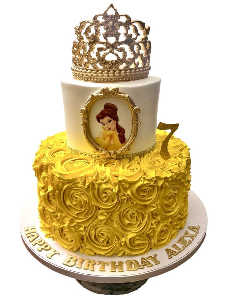 a yellow and white cake with a princess tiara on top