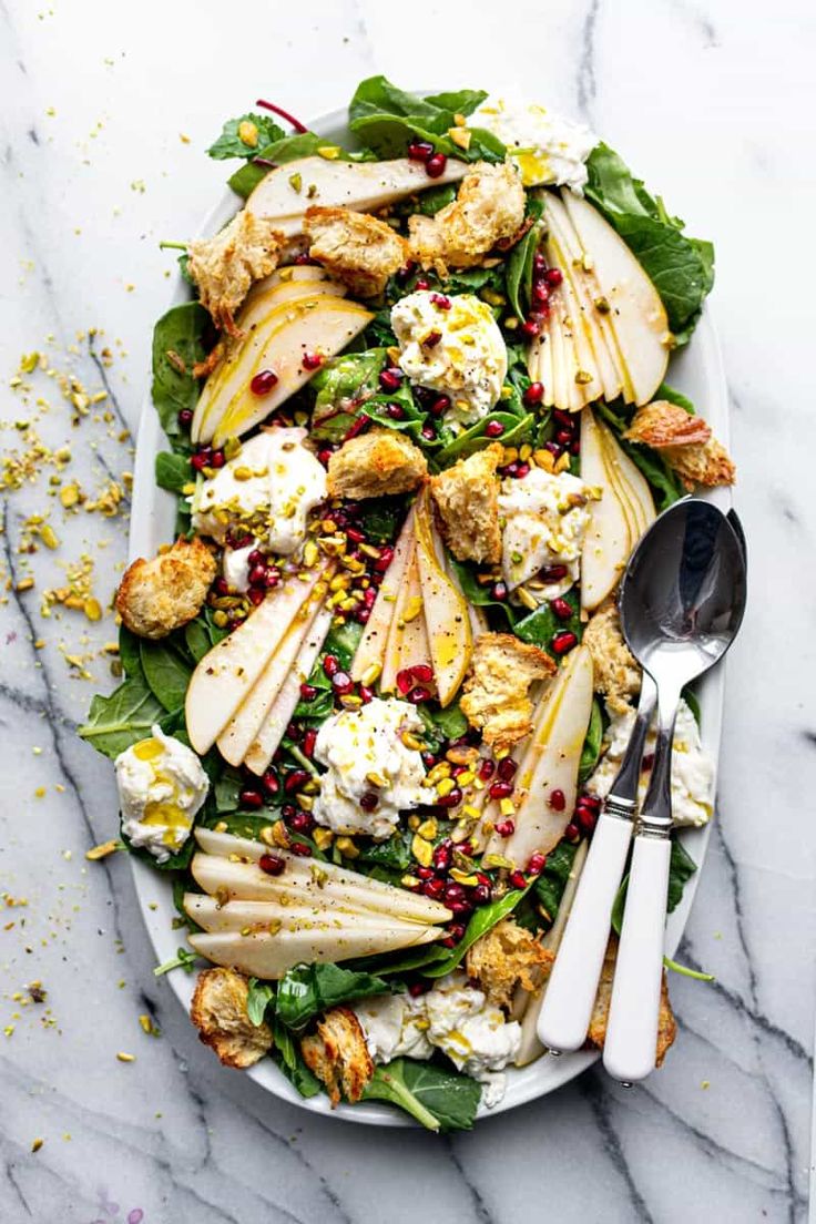 a white plate topped with apples and chicken salad