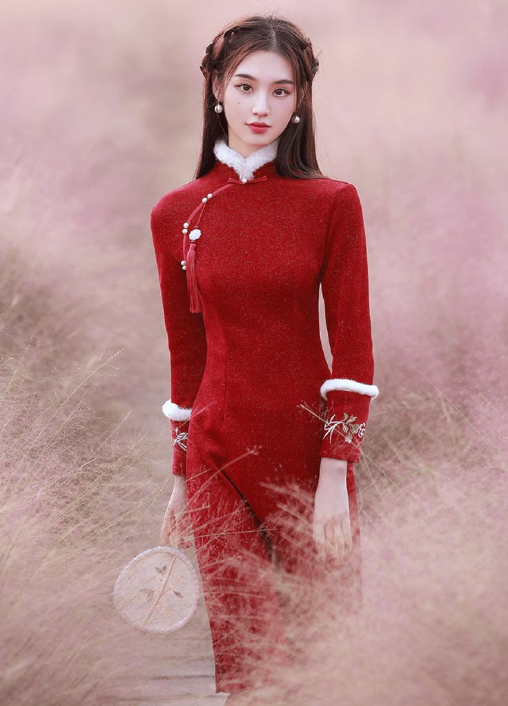 Color: red Silhouette: A-line Length: medium Neckline: mandarin collar Sleeves: long Fabric: velvet Material: polyester Details: floral embroidery on the sleeves A winter qipao in a festive color Stay warm and elegant with our unforgettable winter qipao. Made with quality velvet, this charming Chinese dress will keep you feeling cozy and comfortable in colder weather. The fabric of the dress is soft to the touch and pleasant to wear. The iconic color of this qipao winter dress will create a capt Formal Long Red Cheongsam, Festive Fitted Ao Dai With Stand Collar, Elegant Embroidered Cheongsam With Stand Collar, Elegant Embroidered Ao Dai With Stand Collar, Red Fitted Ao Dai With Stand Collar, Festive Long Fitted Cheongsam, Traditional Long Sleeve Fitted Cheongsam, Festive Long Sleeve Fitted Cheongsam, Festive Fitted Cheongsam With Long Sleeves