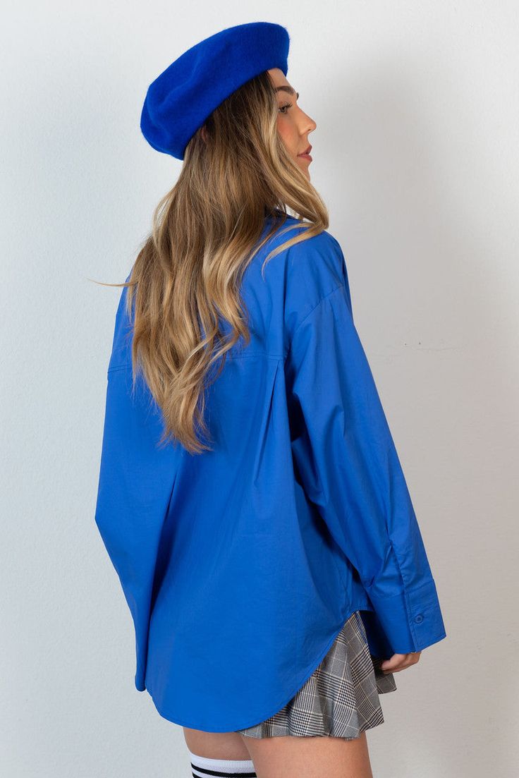 Who doesn't need a crisp oversized button down? The CALIstyle Not Your Boyfriends Oversized Shirt features a crisp cotton fabrication with oversized fit, front pocket, extra long sleeves and button cuff. Color: Cobalt Blue Oversized Button Front Extra Long Button Cuff Sleeve 100% Cotton Model Wearing Size Small and is 32B Bust, 5'5" Tall Oversized Blue Button-up Shirt, Oversized Blue Shirt With Roll-up Sleeves, Oversized Blue Shirt With Button Closure, Oversized Blue Shirt For Work, Oversized Button-up Winter Shirt, Winter Oversized Button-up Shirt, Oversized Shirt With Button Cuffs For Fall, Oversized Blue Winter Shirt, Blue Oversized Winter Shirt