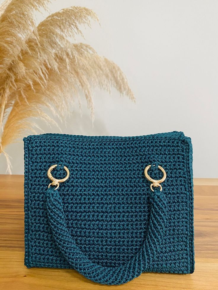 Fashion Bag for Women This crocheted bag is perfect for your fashion needs, captivates with green tones and elegant knot details. Ensuring the bag is both stylish and practical. It features a lined interior. DETAILS: * Hand crocheted and stitched * Fully lined * Clip and gold-detailed chain SIZE AND CARE: 22x17x10 cm (8.66x6.69x3.94 inç)  SEND A MESSAGE FOR A CUSTOMIZED BAG SHIPPING AND RETURNS: * Free shipping * Ready to ship within 3-6 business days * 30-day return policy Green Top Handle Crochet Shopping Bag, Green Crochet Top Handle Bag For Shopping, Green Top Handle Crochet Bag For Shopping, Green Crochet Satchel Bag For Shopping, Green Crochet Top Handle Bag For Everyday, Everyday Green Crochet Top Handle Bag, Green Rectangular Crochet Bag, Green Crochet Top Handle Bag With Braided Handles, Elegant Green Shoulder Bag With Braided Handles