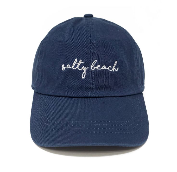 Catch some waves and stay shaded in our Embroidered Salty Beach Baseball Cap! Its adjustable buckle slide ensures it fits most, with 100% cotton to keep you comfy. Perfect for beach days, fishing trips, or summer hikes! Let's get salty! Cotton Beach Baseball Cap, Casual Outdoor Baseball Cap For Beach Season, Summer Baseball Cap For Outdoor Activities, Cotton Baseball Cap For Beach, Casual Adjustable Hats For Beach Season, Adjustable Cotton Hat For Beach Season, Navy Baseball Cap For Summer Outdoor, Casual Adjustable Baseball Cap For Beach Season, Casual Adjustable Baseball Cap For Beach