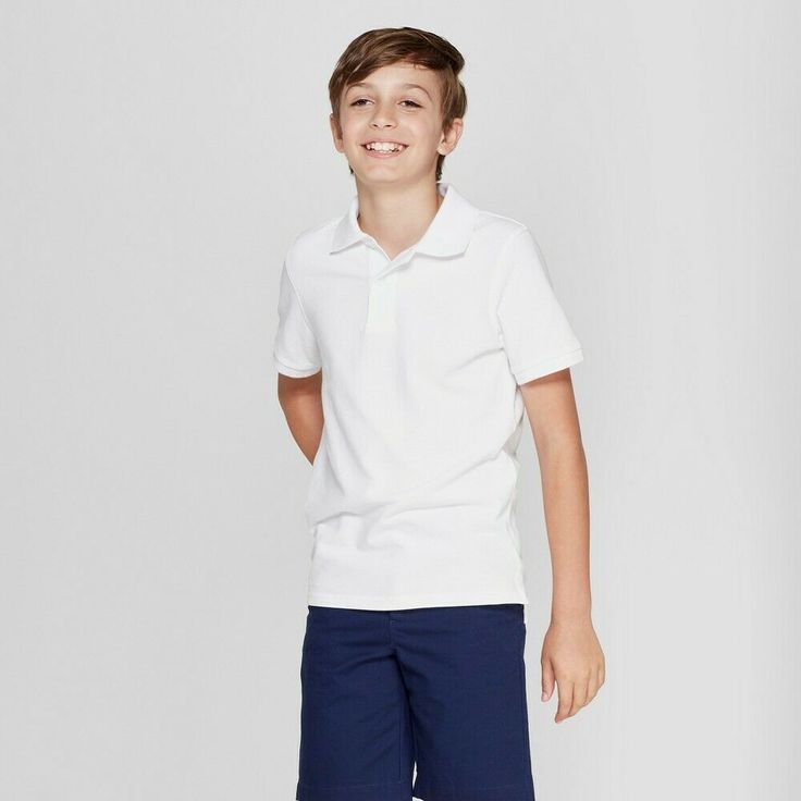 Cat & Jack Boys' Short Sleeve Uniform Polo -  White, XXL(18) Your guy will take on his day with comfort and style with the Short-Sleeve Stretch Pique Uniform Polo Shirt from Cat and Jack . Boasting a breathable and durable pique construction that keeps him cool and comfy, this boys' uniform polo shirt is designed with added spandex that allows him stretchy comfort and easy movement all through the day. Featuring a collared neckline with a two-button placket, this boys' polo shirt adds classic st Grey Shirt Dress, Boys Uniforms, Polo Design, Grey Polo Shirt, Uniform Shirts, Polo Shirt White, Slim Fit Chinos, Jack White, White Polo