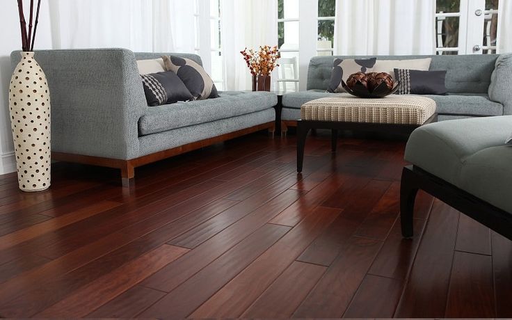 a living room filled with furniture and wooden floors