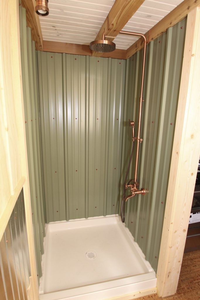 a bathroom with a tub and shower in it