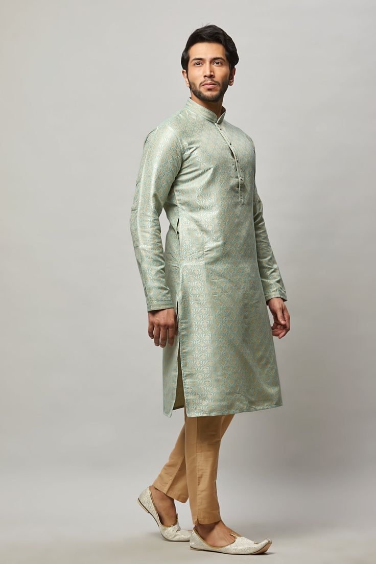 Brocade Kurta with gold embossing & placket plus gold churidar Crafted with a collar neckline, full sleeves, and front button closure. Occasion: Can be worn to lighter events like Sangeet, Mehendi, Puja, or a small party WASH CARE INSTRUCTIONS - Please Dry clean only when it is applicable. Slight color variation is possible due to digital photography. Festive Fitted Kurta With Band Neckline, Elegant Straight Kurta With Zari Weaving, Pista Green Long Sleeve Kurta For Transitional Season, Pista Green Long Sleeve Kurta, Green Long Sleeve Sherwani For Transitional Season, Fitted Kurta With Zari Work And Stand Collar, Elegant Long Sleeve Kurta With Zari Weaving, Traditional Fitted Kurta With Band Neckline, Green Fitted Kurta With Stand Collar