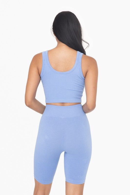 This versatile athleisure top can be layered over your Mono B sports bra during workouts, or paired with casual bottoms and accessories for chic streetwear. It features an all-over ribbed texture and seamless construction. Style: Sporty Print / Pattern: Solid Silhouette: Tank Top Fit: Fitted Embellishment: Seamless Neck Line: V-Neck Sleeve: Sleeveless Length: Cropped Closure: Pullover Lining: No Made In: CHINAFabric Contents: 60% Rayon, 35% Nylon, 5% Spandex Stretch fabric Non-sheer fabric Care Blue Seamless Activewear, Summer Ribbed Tank Top, Ribbed Crop Top For Gym In Spring, Spring Ribbed Crop Top For Gym, Casual Cropped Ribbed Sports Bra, Casual Ribbed Cropped Activewear, Ribbed Cropped Gym Top, Trendy Ribbed Sports Bra For Spring, Athleisure Ribbed Crop Tank Top