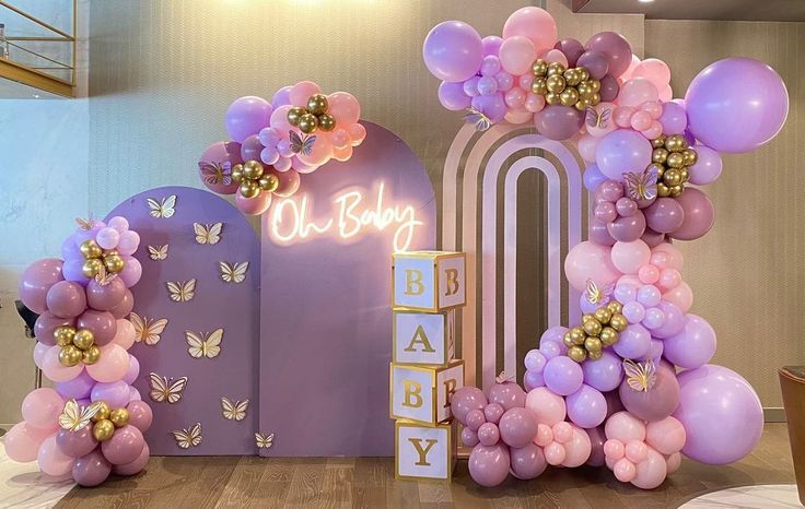 balloons are arranged around the letters for a baby shower