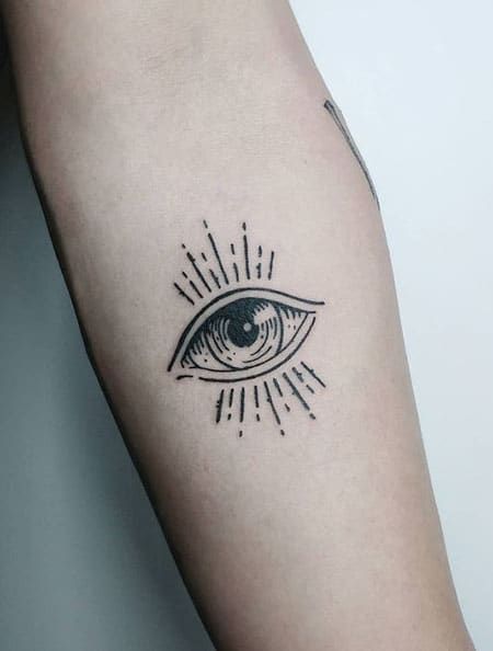 an all seeing eye tattoo on the arm