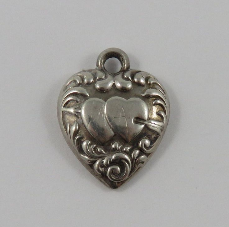 "This is a vintage \"Puffy Heart\" sterling silver charm for a charm bracelet.  It weighs .95 grams and measures 5/8\" X 3/4\", marked \"STERLING\" All charms come with a split ring to attach to a bracelet. We have hundreds of charms in stock. If you don't see what you are looking for in our shop please contact us as it is likely we have it. Inventory #13162" Shop Jewelry, Puffy Heart, Split Ring, Sterling Silver Charm, Vintage Charms, Sterling Silber, Jewelry Supplies, Arm Band, Jewelry Shop