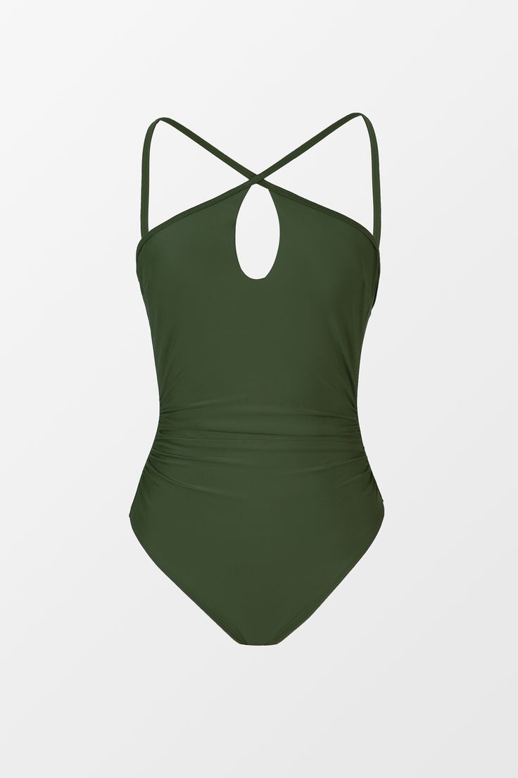 Dive into confidence with our Green Cutout Ruched Tummy Control One-Piece. Designed to flatter your figure with its strategic cutouts and ruched detailing, this swimsuit offers both style and support. Product code: DAA12E4E009RR Features:  Crisscross halter neckline Removable cups Medium bust support Adjustable cami straps Front cutout Back tie Tummy control Cheeky high-leg cut Modern bum Wash Method: Regular Wash Lining: 92%POLYESTER,8%SPANDEX Material: 82%NYLON,18%SPANDEX. Green Ruched Swimwear For The Pool, Green Ruched Swimwear For Pool, Ruched Backless Swimwear For Pool, Solid One-piece Swimwear With Ruched Back, Green Ruched Swimwear For Poolside, Summer Swimwear With Ruched Back For Pool, Ruched One-piece Swimming Bodysuit, Ruched Tankini For Swimming, Ruched Bodysuit For Swimming Beachwear