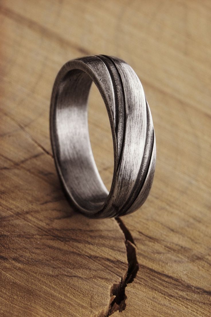 Simplicity is a charm! Engraved lines, a unique oxidized look, and sterling silver create a band you'll never want to take off. Add a personalized touch by having it engraved on the inside. A gift to wear all day, every day! PRODUCT DETAILS The ring is 5.6mm wide (approx. 0.22in) and 1.7mm thick (approx. 0.06in). The ring is oxidized to bring out its unique look. OPTIONS --> The ring is available in many different sizes. You may choose the one you wish from the drop-down menu. If you prefer a Engraved Silver Ring, Ring Of Honor, Oxidized Silver Rings, Silver Engraving, Unisex Ring, Unisex Jewelry, Silver Band Ring, Oxidized Silver, Wide Bands