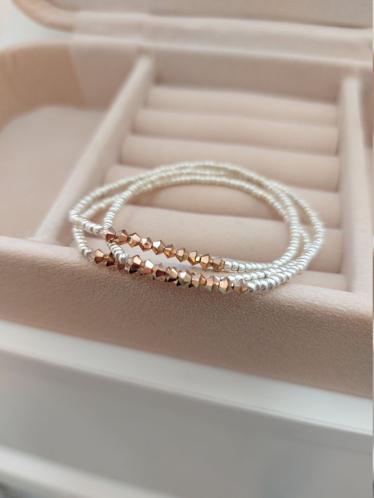 "Rose Gold Bracelet, Soft gold bracelet,stacking bracelets, stretch beaded bracelets. More items in soft/pale gold: https://www.etsy.com/shop/StephanieMartinCo?ref=seller-platform-mcnav&search_query=soft+gold ❤ SIZES This item comes in several sizes. Kindly choose at checkout. The standard size for an average woman is 7\". For a child, a 6\" would be appropriate. I recommend you measure your wrist to determine the best fit. ❤ PROCESSING AND SHIPPING Most orders are made and shipped out in on Elegant Wrap Bracelet With Spacer Beads For Gift, Dainty Rose Gold Stackable Beaded Bracelets, Dainty Rose Gold Stretch Bracelet Gift, Elegant Wrap Bracelet With Tiny Beads As A Gift, Elegant Wrap Bracelet With Tiny Beads For Gift, Elegant Everyday Rose Gold Stretch Bracelet, Gold Crystal Bracelet With Silver Beads As Gift, Delicate Rose Gold Beaded Bracelets With Round Beads, Delicate Stackable Beaded Bracelets