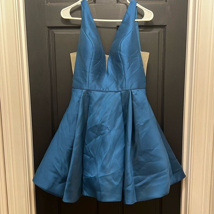 Sherri Hill Size 10 Blue Dress Deep V But With Cloth Across The Cross Cut Low In Sides But Also With Cloth. Lined Built In Padded Skirt Has Extra Layers For Fullness. Great Condition 15” Across At Waist 34” Shoulder To Hem Blue A-line Midi Dress For Formal Occasions, Light Blue A-line Mini Dress For Evening, Light Blue Pleated V-neck Dress, Light Blue V-neck Homecoming Dress, Blue Knee-length Homecoming Mini Dress, Blue Knee-length Mini Dress For Homecoming, Light Blue A-line Pleated Dress, Light Blue Pleated A-line Dress, Blue Knee-length Midi Dress For Prom