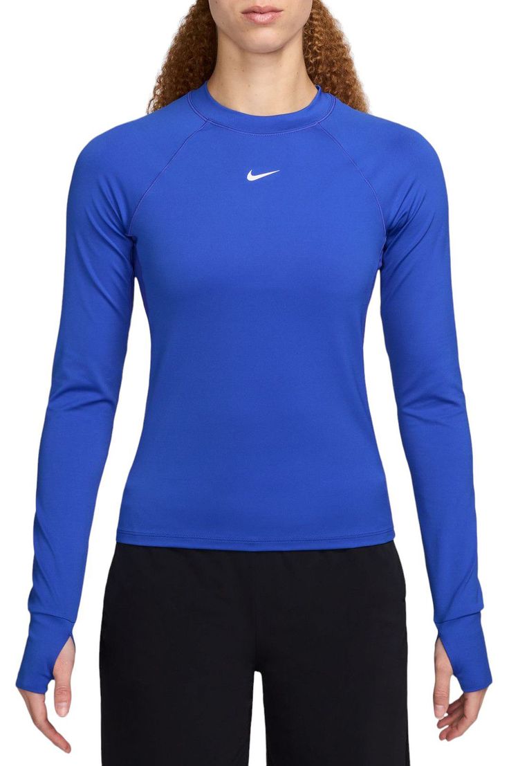 Ready to turn up the heat on your workout? Reach for this fitted long-sleeve top. Thumbholes help keep the sleeves in place through your entire routine. Lightweight and stretchy, the smooth fabric dries quickly and works with you through every move. Mesh panels under the arms let moisture escape so that finishing strong is no sweat. Fit & Design: Fitted Lightweight and stretchy fabric Mesh panels under the arms help increase airflow Thumbholes help keep sleeves in place Nike Dri-FIT technology moves sweat away from your skin for quicker evaporation, helping you stay dry and comfortable Sporty Long Sleeve High Stretch Rash Guard, Sporty Stretch Rash Guard With Thumbholes, Stretch Long Sleeve Rash Guard Athleisure, Blue Technical Long Sleeve Activewear, Stretch Athleisure Long Sleeve Rash Guard, Stretch Long Sleeve Rash Guard For Athleisure, Fitted Long Sleeve Athleisure Top With Thumbholes, Fitted Long Sleeve Top With Thumbholes For Athleisure, Stretch Moisture-wicking Long Sleeve Rash Guard