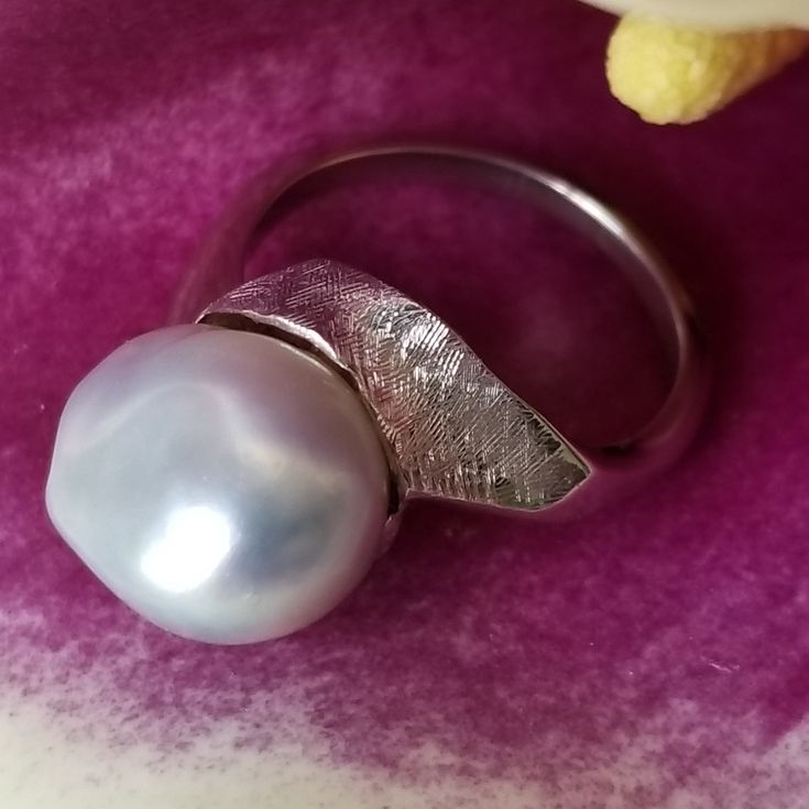 "* This beautiful pearl ring would be a wonderful gift to a bride on her wedding day, or perhaps the mother of the bride or groom! The silvery gray pearl is is unique and beautful, giving this ring tons of understated charm and elegance. This ring is very sturdy and well-made, and it shows! * This piece weighs 6.7 grams, and is stamped \"14K\" inside the shank. The pearls measure approximately 12.6 mm x 12.9 mm This ring is a US size 7. Please message us about sizing options prior to purchase! * Luxury Silver Pearl Ring For Wedding, Silver Akoya Pearl Ring For Anniversary, Silver Akoya Pearl Drop Ring, Modern Silver Pearl Ring For Gifting, Modern Silver Pearl Ring As Gift, Silver High Luster Pearl Ring For Anniversary, White Gold Pearl Ring With High Luster For Wedding, Silver Akoya Pearl Ring With Pearl Drop, Unique White Gold Pearl Ring For Formal Occasions