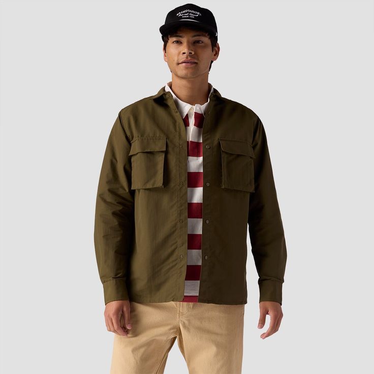 For those of us who think buttons are boring, the Stoic Utility Long Sleeve Snap Up features snap closures on the front, on the sleeves, and on the pockets for a fun riff on the classic button up shirt. Casual Button-up Camp Shirt With Pockets, Streetwear Button-up Tops With Flap Pockets, Urban Style Button-up Tops With Pockets, Urban Button-up Top With Pockets, Casual Long Sleeve Camp Shirt With Button Closure, Casual Button-up Outdoor Shirt, Casual Button-up Shirt For Outdoor, Fall Streetwear Tops With Buttoned Pockets, Classic Button-up Camp Shirt With Patch Pockets