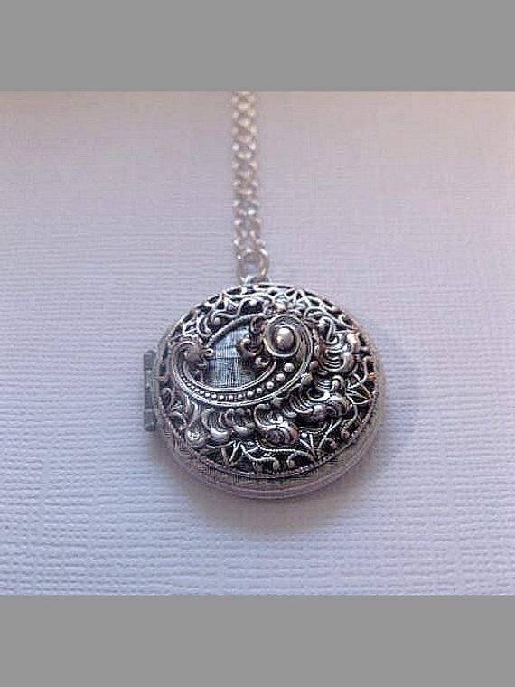 Fancy Locket Necklace The Locket: - Open and close locket allows insertion of photo - Measures 32mm round (1.25 inches round) Chain: - Silver Plated - YOU CHOOSE YOUR CHAIN LENGTH FROM DROP DOWN MENU TOOL ☻☻ TO see MORE of our LOCKET NECKLACEs (while supplies last): https://www.etsy.com/shop/FashionCrashJewelry/search?search_query=locket&order=date_desc&view_type=gallery&ref=shop_search ☻ Link To My Entire Shop Here: https://www.etsy.com/shop/FashionCrashJewelry?ref=hdr_shop_menu INT Formal Locket Necklace With Intricate Round Pendant, Vintage Circle Necklace For Gifting, Vintage Circle Necklace For Gifts, Wedding Locket Necklace In Metal, Wedding Metal Locket Necklace, Ornate Formal Locket Necklace, Formal Ornate Round Locket Necklace, Vintage Locket Necklace With Adjustable Chain For Wedding, Metal Pendant Locket Necklace For Wedding