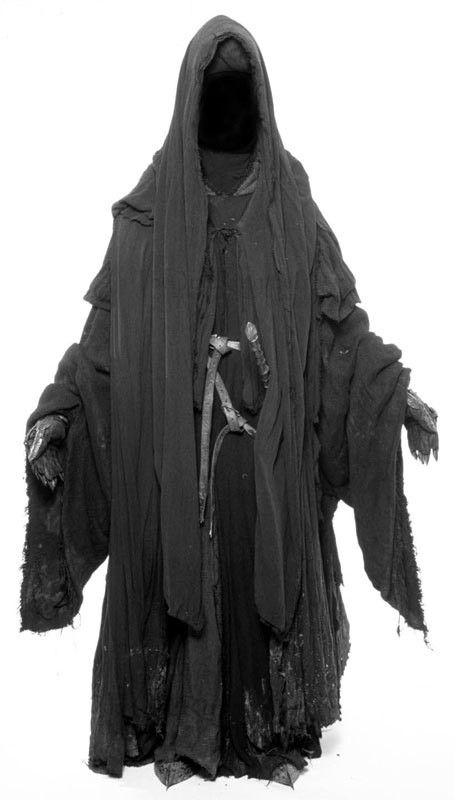 an image of a person dressed up in black and wearing a hooded costume with horns