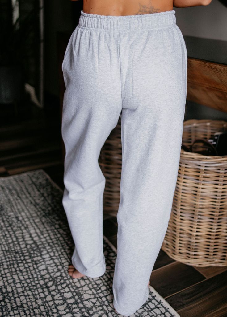 Crafted from high-quality fleece, these joggers feature a drawstring waistband, side pockets, and a soft interior for maximum warmth. For a full matching set pair with the matching Essential Hoodie by Lily & Lottie! Fits oversized. Laurie: prefers a size small. Loghin: prefers a size XL. Brittany: prefers a size small. Madison: prefers a size small. Kaylee: prefers a size 2XL. Materials: 93% Cotton 7% Polyester Measurements: Small: Waist: 25" | Inseam: 27" | Rise: 11" Medium: Waist: 27" | Inseam Cozy Leisure Sweats, Winter Loungewear Bottoms With Drawstring, Cozy Long Pants Joggers For Loungewear, Cozy Long Joggers For Loungewear, Comfy Sweatpants With Elastic Cuffs For Lounging, Winter Loungewear Sweats With Drawstring, Cozy Relaxed Fit Sweatpants For Loungewear, Cozy Fit Casual Sweatpants For Loungewear, Cozy Sweatpants With Ribbed Waistband For Loungewear