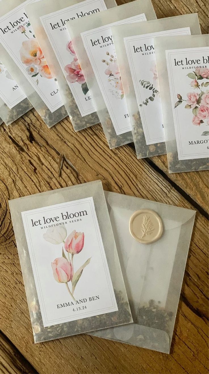 six packets of let love bloom tea sitting on a table next to a wax seal