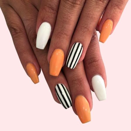 Orange Nails: Beetlejuice Stripes. Alternating orange and white nails with black striped accents. Click through for 26 orange nail ideas. #orangenailideas #orangenails #nailideas IG: @thecosmostudio Halloween Nails Diy, Holloween Nails, Halloween Acrylic Nails, Cute Halloween Nails, Fall Acrylic Nails, Cute Gel Nails, Nails 2021, Acrylic Nails Coffin Short, Nails Fall