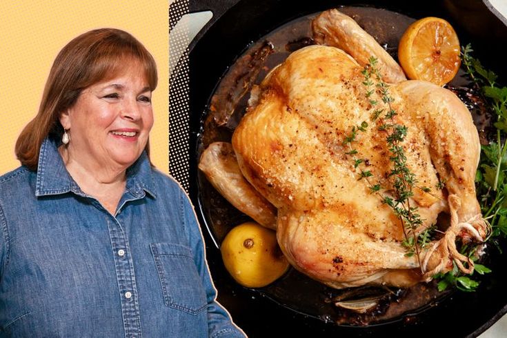 a woman standing next to a roasting pan filled with chicken and lemons