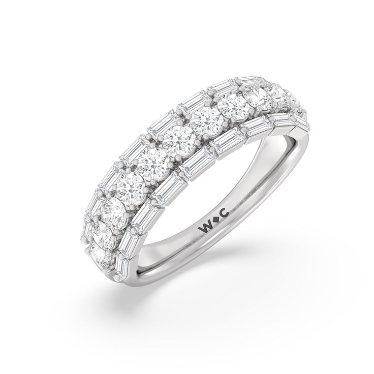 A classic half-eternity ring with a deep and diverse brilliance. This anniversary ring features a central arch of round diamonds sandwiched between two rows of baguette-cut diamonds. The edges of the shank are slightly ridged to follow the silhouette of the step-cut gems. Interesting Jewelry, Diamond Pendants Designs, Diamond Pendants, Baguette Ring, Gorgeous Engagement Ring, Diamond Anniversary Rings, Step Cut, Half Eternity Ring, Baguette Cut Diamond