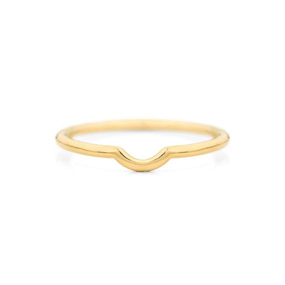 a gold ring with an open wave design on the front, and a thin band at the bottom