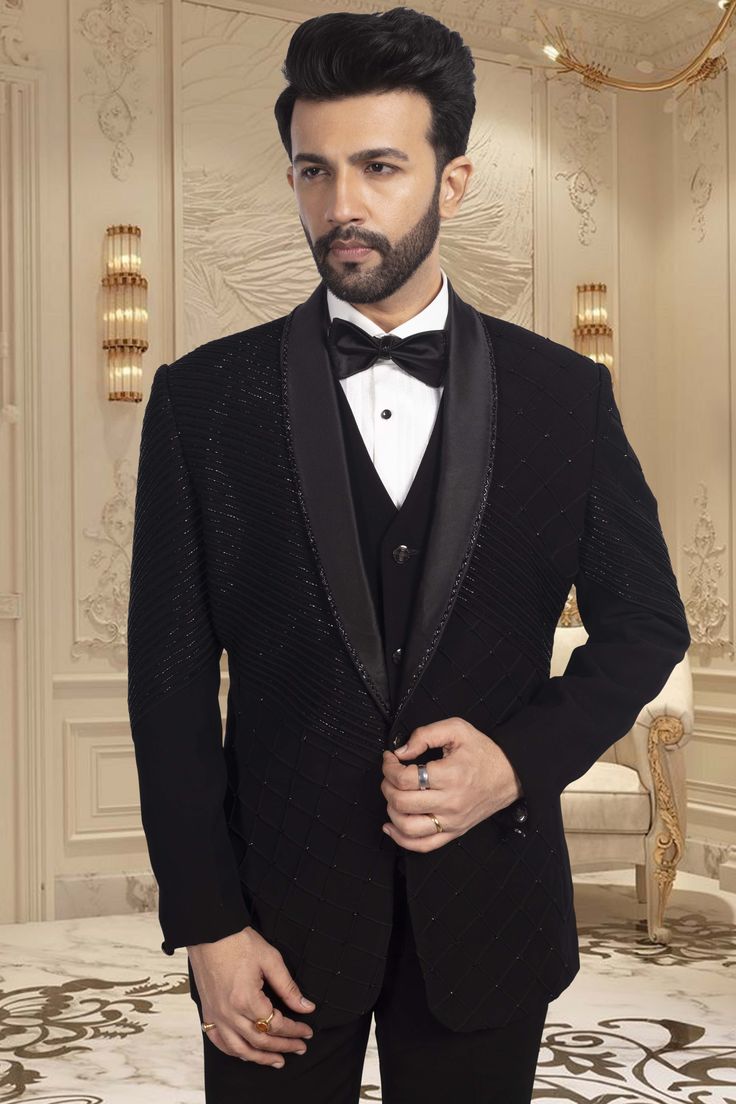 This TUXEDO- R14-S63 showcases stunning black cutdana embroidery, adding a touch of elegance and sophistication to your ensemble. Expertly crafted with precision and attention to detail, this tuxedo is the perfect choice for any formal occasion. Its intricate design is sure to make you stand out in the crowd. Tailored Evening Party Wear Suits, Elegant Tuxedo For Black-tie Festive Events, Black Tuxedo For Evening Party Wear, Black Tuxedo For Evening Party, Black Party Wear Tuxedo For Evening, Tailored Sets For Black-tie Festive Events, Black Fitted Bandhgala For Semi-formal Occasions, Black Tuxedo For Black-tie Gala, Black Tuxedo For Black-tie Gala Events