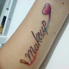 a woman's arm with the word love written in cursive writing