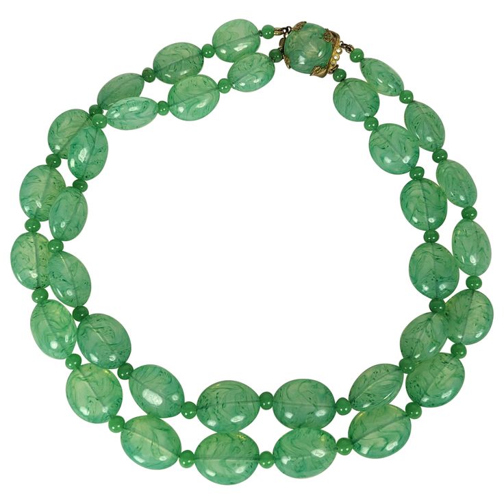 French Poured Glass Faux Jade Beads from the 1950's. Double strand with hand made mottled Gripoix glass beads and spacers in variegated jade tones with gilt filigree clasp. 17.5" shorter strand, 1.5" drop in front. 1950's France. Jade Beads, Drop In, Myanmar, Glass Beads, Jade, Hand Made, Beaded Necklace, Jewelry Necklaces, France