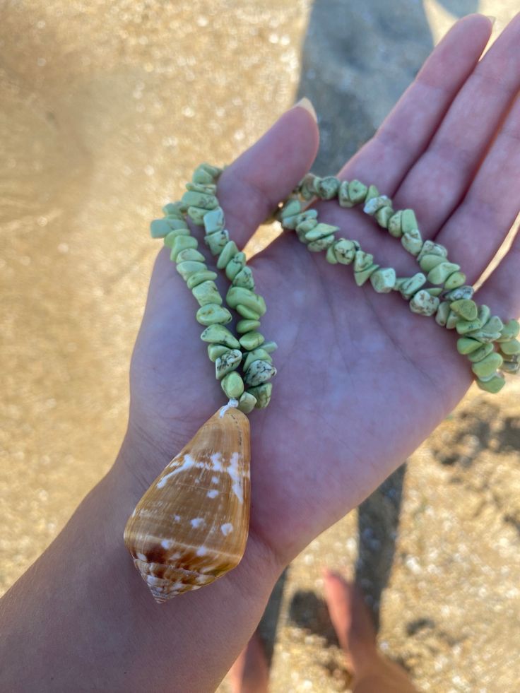 This necklace is handmade with an ethically handpicked seashell and green gemstones. The necklace length is adjustable with a sliding knot. shortest length: 44cm  longest length: 60cm Green Shell Jewelry For Beach, Ocean-inspired Green Jewelry For Vacation, Green Ocean-inspired Jewelry For Vacation, Beach Jewelry With Gemstone Shell Beads, Shell Jewelry With Gemstone Beads For Beach, Green Strand Necklaces For Beach, Adjustable Shell Necklace With Natural Stones For Vacation, Green Strand Jewelry For Vacation, Green Bohemian Beaded Necklaces For Beach