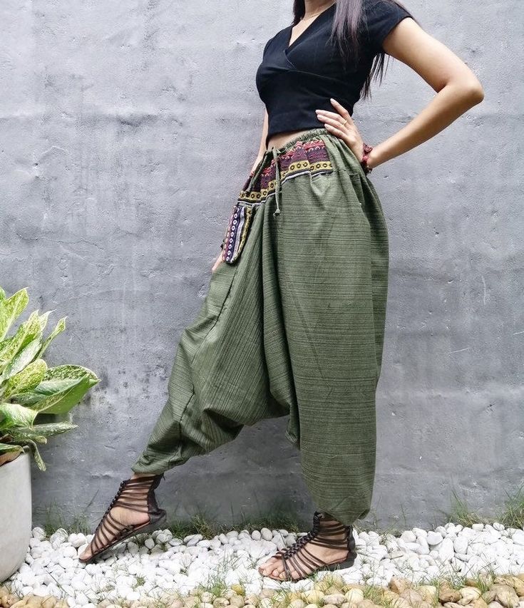 "The harem style trousers made from cotton fabric 100%with an elasticated smock waist and ankles they provide a comfortable lightweight fit, perfect for casual wear, festivals, yoga, holidays as well as pairing with a plain top to get that popular look. D I S C O U N T & P R O M O T I O N ❤ Buy 2 or more items, get 10% off ❤ Buy 4 or more items, get 15% off ENTER the coupon code: IYARA015 ❤ Buy 6 or more items, get 15% off ENTER the coupon code: IYARA020 PLEASE NOTE I can not apply a discoun Harem Pants Aesthetic, Baggy Fantasy Clothes, Casual Harem Pants For Festivals, Casual Festival Harem Pants, Spring Festival Ankle-length Harem Pants, Cotton Hippie Harem Pants For Yoga, Baggy Cotton Harem Pants Ankle-length, Baggy Cotton Ankle-length Harem Pants, Green Baggy Harem Pants