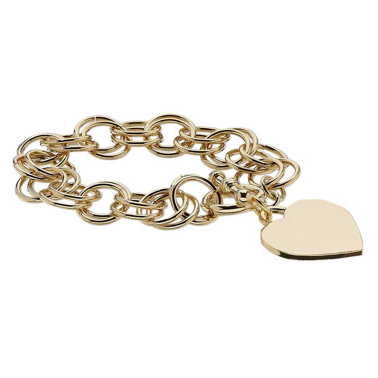 Double-ring chain with a sturdy toggle clasp supports a large smooth heart-shaped charm. Gold Metal Charm Bracelet With Toggle Clasp, Everyday Metal Heart-shaped Jewelry, Everyday Metal Heart Jewelry, Everyday Heart-shaped Metal Jewelry, Gold Metal Bracelet With Toggle Clasp, Gold-tone Metal Bracelet With Toggle Clasp, Gold Heart Charm Bracelet Classic Style, Heart-shaped Brass Jewelry With Lobster Clasp, Classic Gold Charm Bracelet With Heart