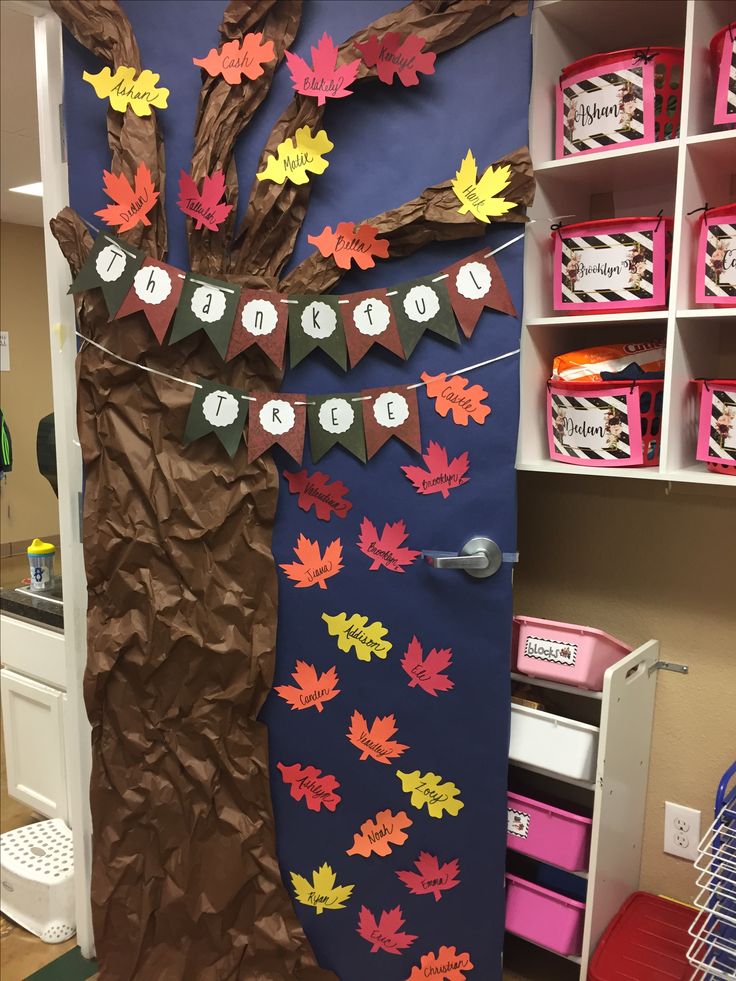 a classroom door decorated with fall leaves