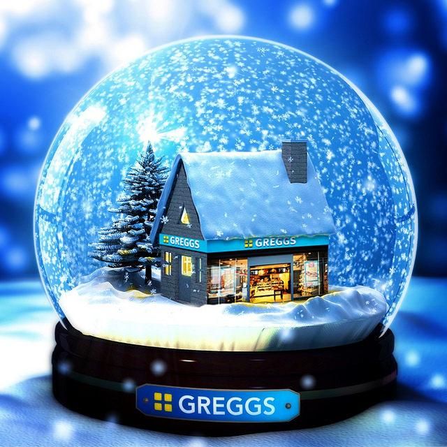 there is a snow globe with a small house in the center and trees inside it