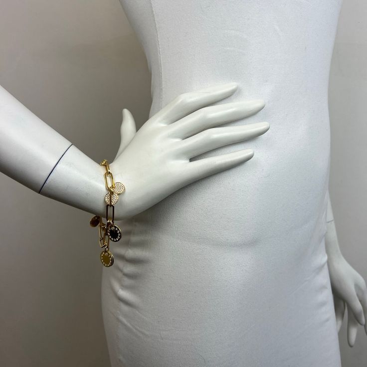 18K Gold Chain 8" Bracelet with Diamond Studded Disc Charms (includes appraisal, Value: $13,000, one stone is missing) Designer = Jewelry Material = 18K Gold Gemstone = Diamond Condition = Very Good Class = Premier Location: Chicago Item Number: 14175-209 Item ID: 274024 Category: Bracelet Luxury Gold-tone Metal Bracelet, Designer Gold Metal Chain Bracelet, Designer Gold Chain Bracelet, Luxury Metal Bracelet Jewelry, Designer Gold-tone Metal Bracelet, Designer Gold-tone Metal Bracelets, Luxury Metal Bangle Charm Bracelet, Gold-tone Oyster Bracelet Luxury Jewelry, Luxury Metal Oyster Bracelet