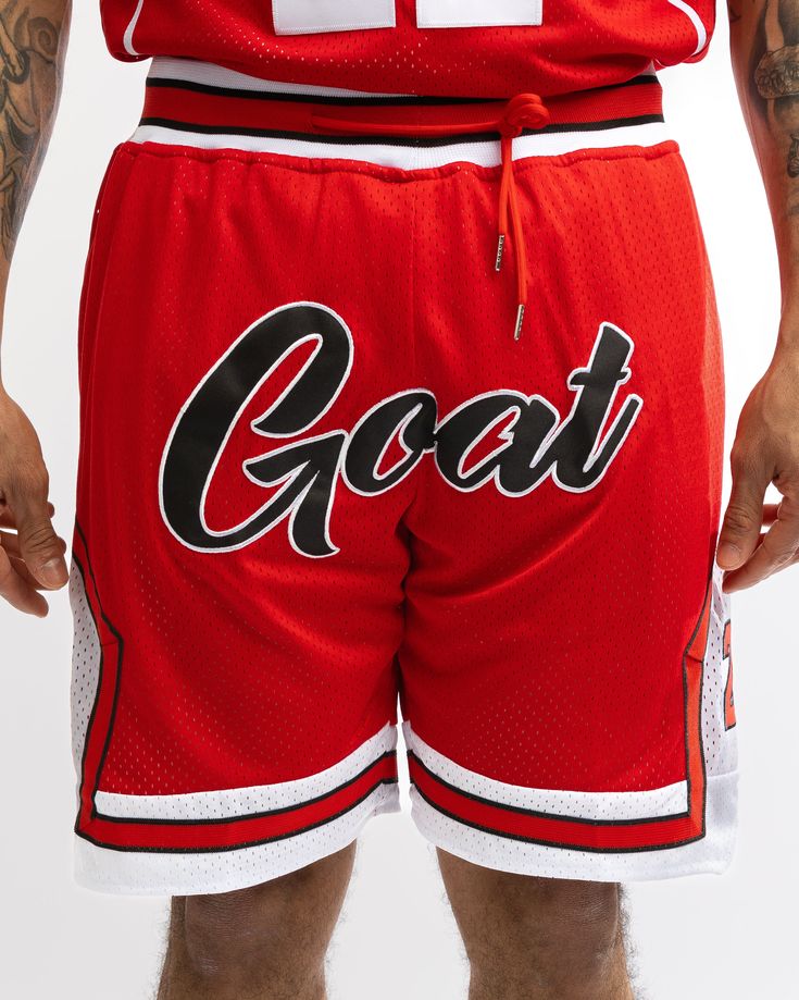 Combine your love of sports, streetwear and nostalgia by copping the GOAT Basketball Shorts. Featuring a mesh construction for a comfortable and customized fit. Contrast trims keep these shorts looking straight fire and make them a stand out, on and off the court. Cop yours today and roll with the pros!- The Goat Basketball Shorts- Ultra-Comfortable, Silky Smooth Inner Lining- Elasticated Waistband- 100% Mesh Fabric- Fully Embroidered Names and Numbers- True to size, US Sizing Go-dry Nylon Athletic Shorts For Streetwear, Red Sporty Shorts For Sports Events, Sporty Red Shorts For Sports Events, Red Training Bottoms For Sports Season, Red Athletic Shorts For Sports Events, Casual Red Breathable Athletic Shorts, Breathable Red Sports Shorts, Sporty Shorts With Letter Print For Sports, Red Athletic Shorts For Streetwear