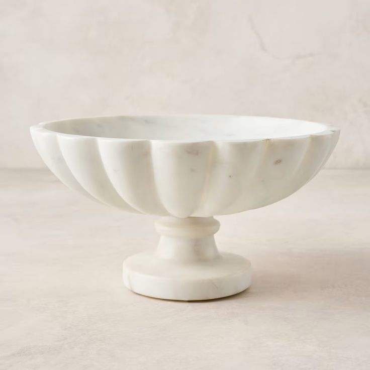 a white bowl sitting on top of a table