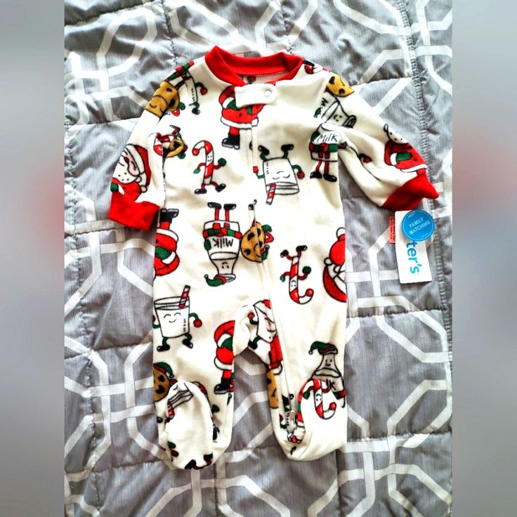 Carter's - Nwt - White Fleece Footed Zip Up Pajamas - Santa Milk & Cookies - May Have Damage To The Price Tag. Does Not Affect The Item. All Items Are Brand New. Shipping Is Next Day Unless It Follows On A Weekend Or Holiday! If You Have Any Questions Please Feel Free To Ask! Bundle And Save On Shipping! Please Send Reasonable Offers!! Cute Christmas Long Sleeve Sleepwear, Cute Christmas Sleepwear With Long Sleeves, Cute Long Sleeve Christmas Sleepwear, White Winter Pajama Party Sets, White Pajama Party Set For Winter, White Sets For Winter Pajama Party, White Sets For Pajama Party In Winter, Playful Winter Onesie For Bedtime, White Christmas Sleepwear Sets